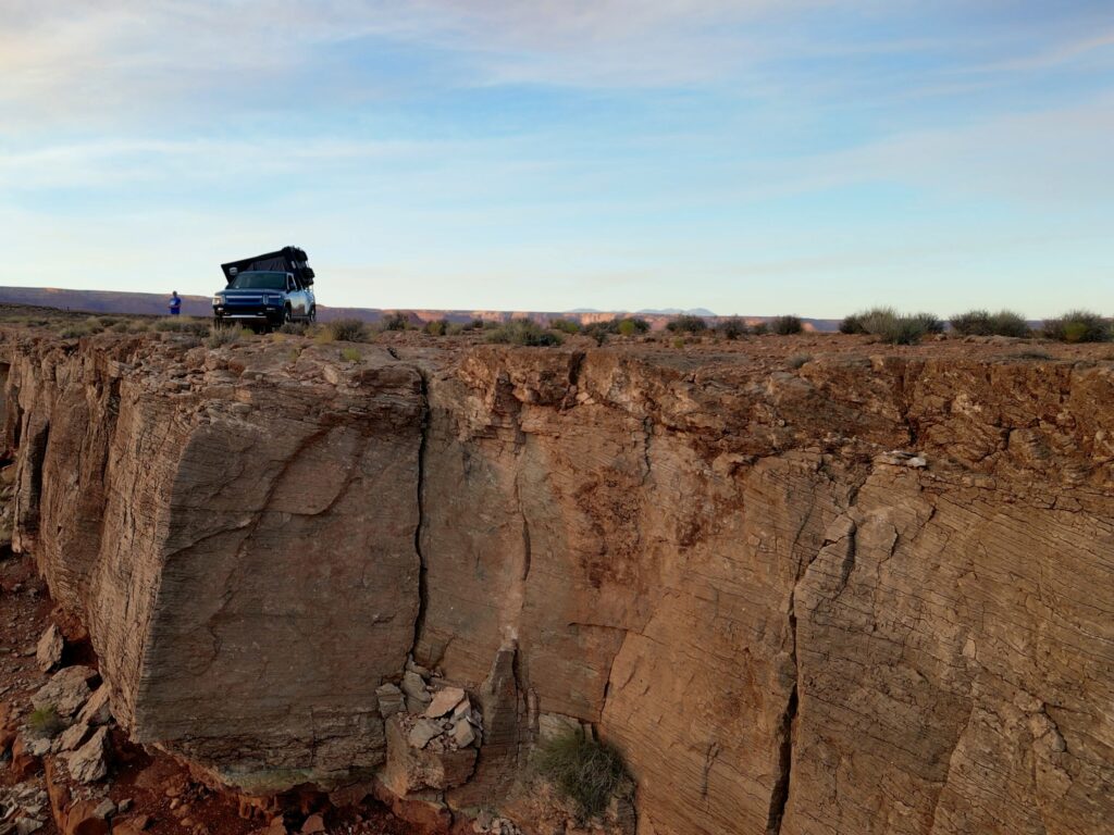 Epic Hero shot of cliffside campsite at Goosenecks State Park.