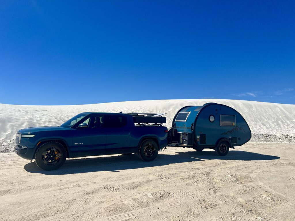 Rivian R1T and teardrop camper at White Sands National Park